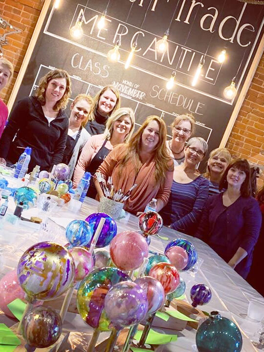 11 women completing a fun winter-themed art class at Smith and Trade Mercantile.